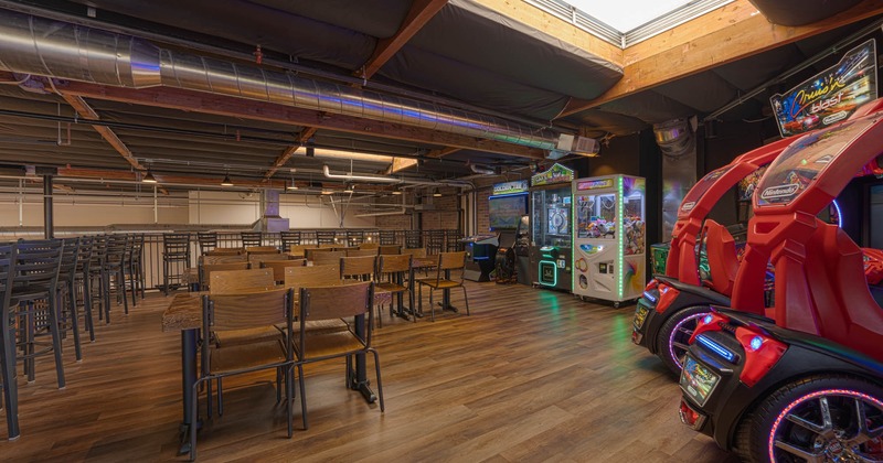 Interior, tables and seats upstairs, arcade gaming area