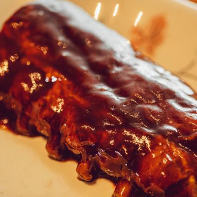 Baby back ribs in house BBQ sauce, closeup