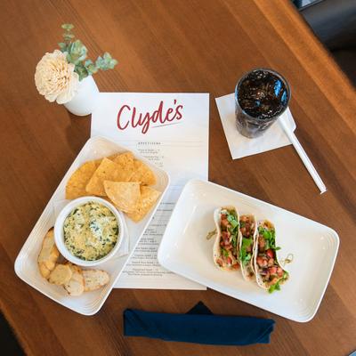 Chips and Cheese dip, Salmon Tacos, and soda.