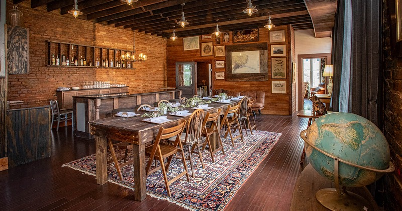 Interior, dining area with long wooden table