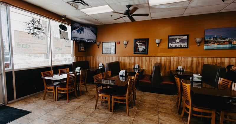 Interior, tables and chairs in dining area