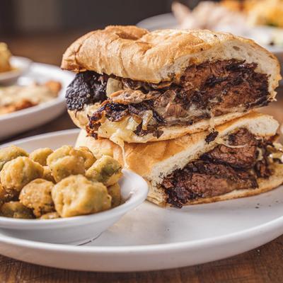 Prime brisket sandwich served with fried okra