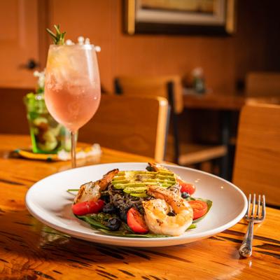Mixed decorated salad, cocktail on the side