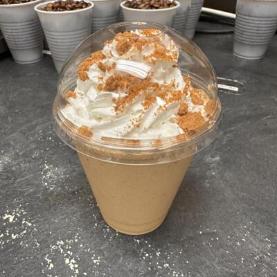 A Biscoff Cookie Butter Frappuccino topped with whipped cream and crumbled Biscoff Cookies.