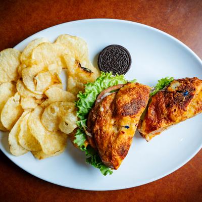 Chipotle Chicken sandwich served with potato chips and a cookie.