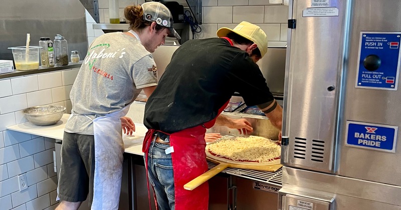 Pizza makers in the kitchen