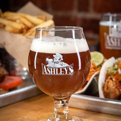 A glass of beer and food.