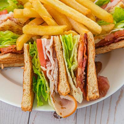 Club Sandwich with fries on the side.