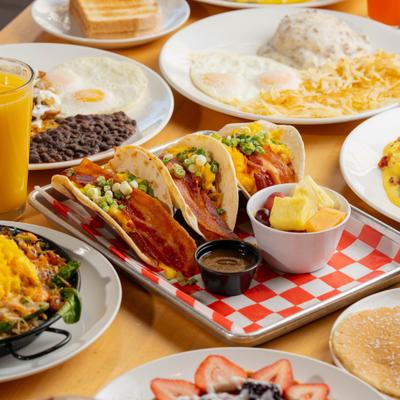 Breakfast Tacos served on the table with other dishes.