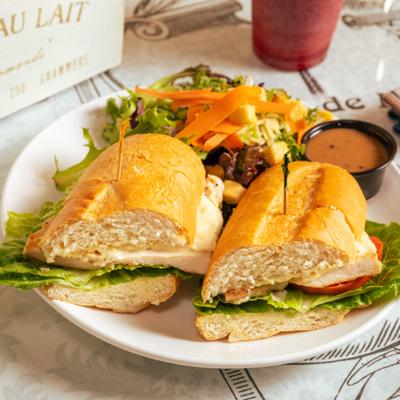 Hot Grill Chicken Breast Sandwich served with side salad and a dipping sauce.
