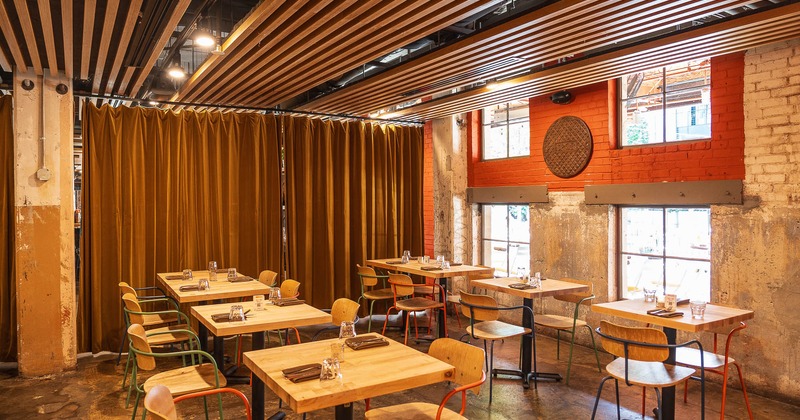 Interior, dining area with tables set for guests