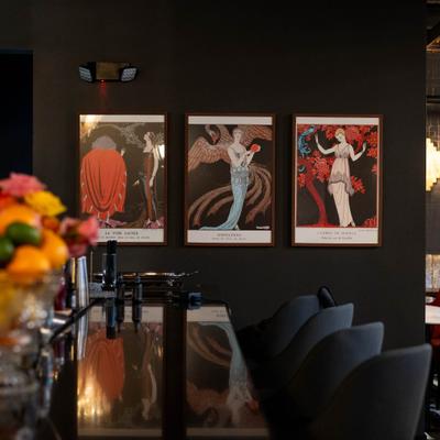 View on the bar with seats and wall decorations.