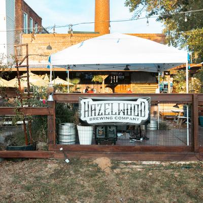 The exterior patio and brewing kegs.