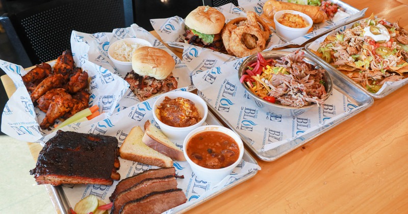 Multiple platters with various dishes