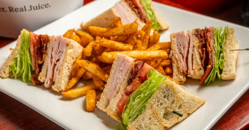 Turkey Club Sandwich and fries