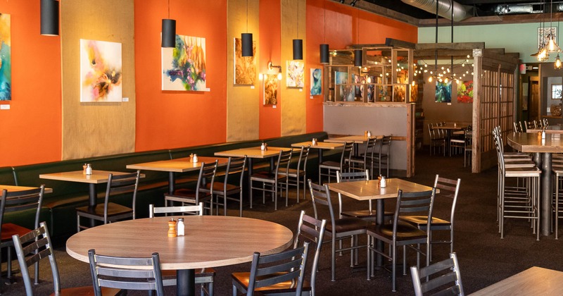 Interior,  guest tables, seat, pictures on the wall