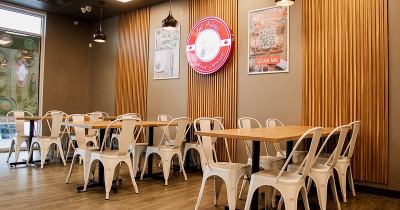 Interior, tables and chairs with window in the background
