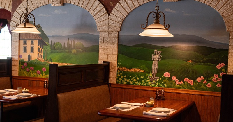 Interior, restaurant booth near decorated wall