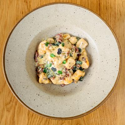 Sweet potato gnocchi with kale, prosciutto and sage butter.