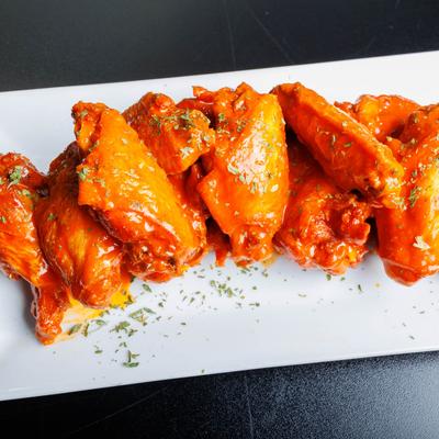 Served chicken wings, angled view.