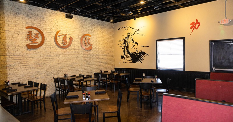 Spacious and cozy interior dining area with dining tables ready for guests