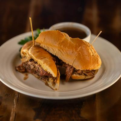 Prime beef rib sandwich with au jus for dipping.
