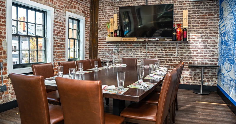 Private parties room, table with glasses and accessories for 12 guests