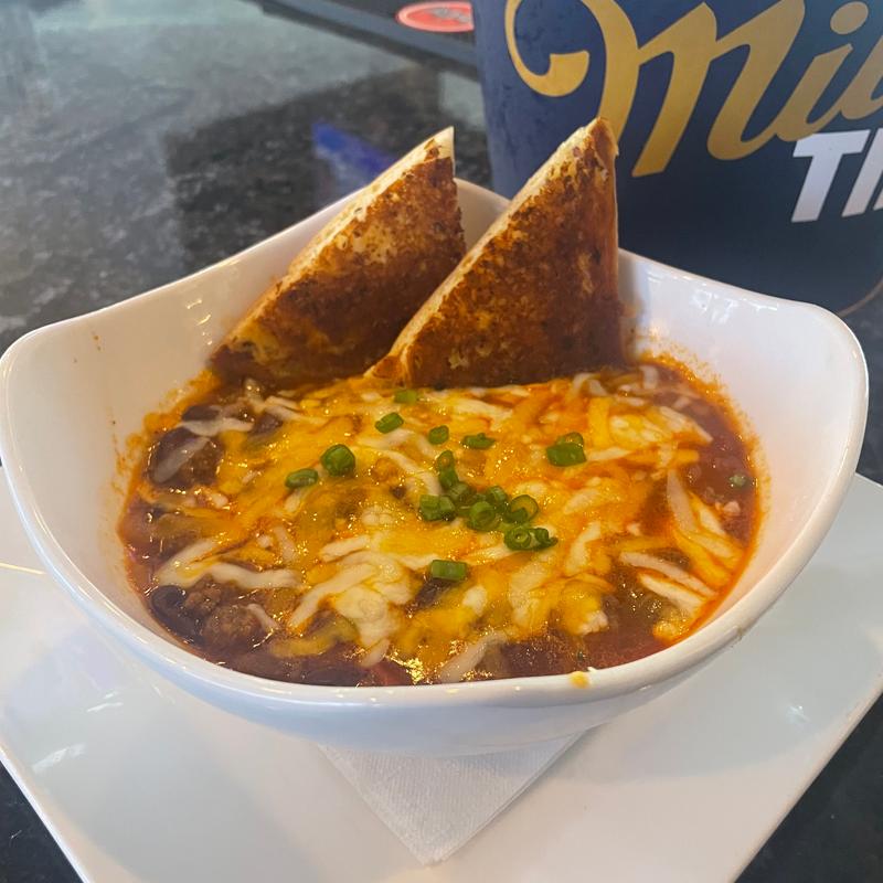 Bowl of Chili with garlic bread photo