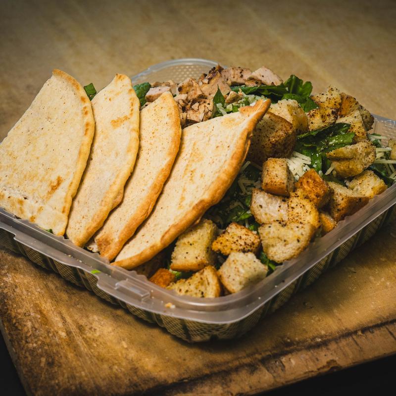 Chicken salad with a side of pita bread