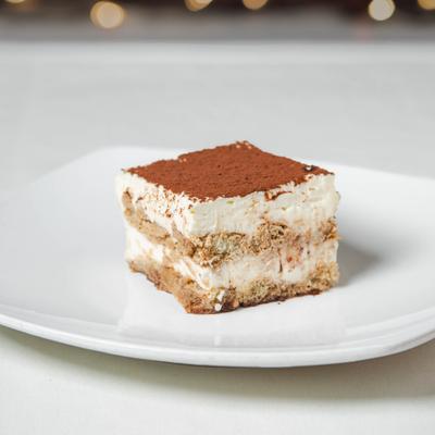 Served tiramisu on the plate.