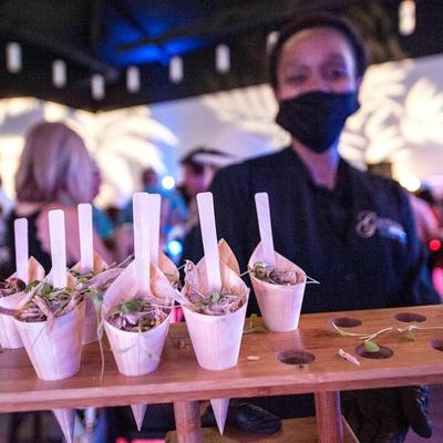 Server with appetizers.