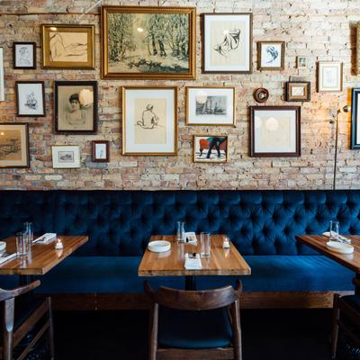 Interior, seating area, lots of framed pictures on the wall