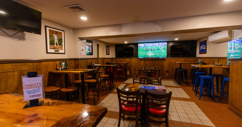 Interior, dining area with a large wall TV set