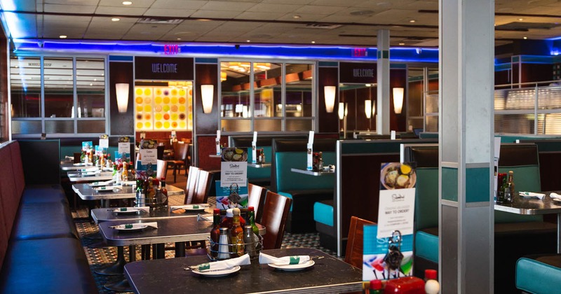 Interior, seating, lined up tables with tableware, booths
