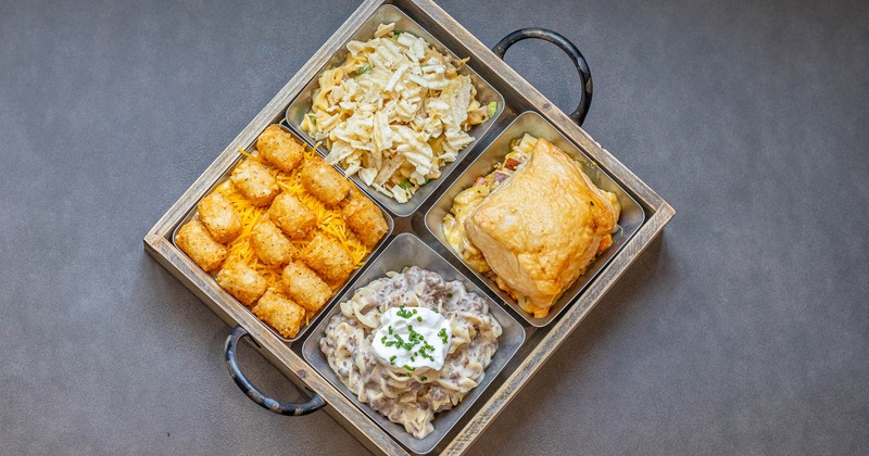 Hot dish sampler with tater tots, pasta salad, creamy beef noodles, and pot pie
