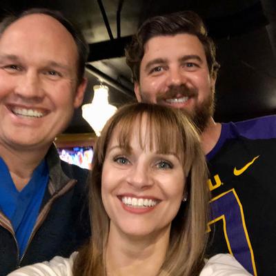 3 smiling LSU Football fans,