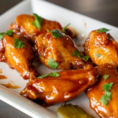 Classic Wings garnished with fresh herbs.