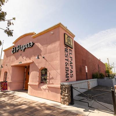 Exterior ,angle view to entrance and sign above.