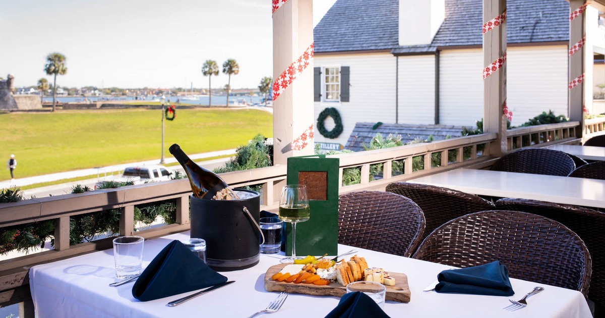 Terrace seating area, tables and chairs, food served on the table