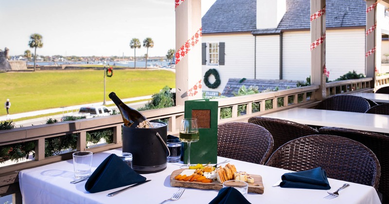 Terrace seating area, tables and chairs, food served on the table