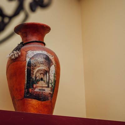 Exterior details, a clay jug with picture