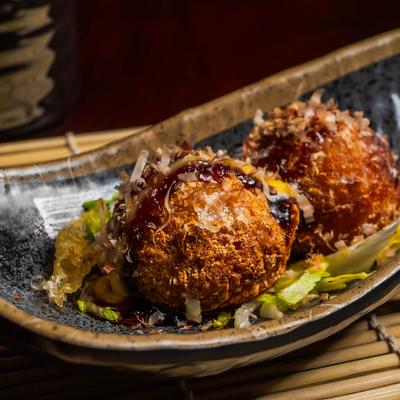 Ball shaped snack, stuffed with octopus, closeup.