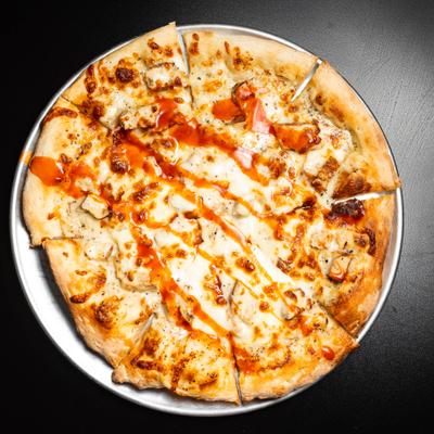 White Buffalo Pizza servd on a metal tray, overhead view.