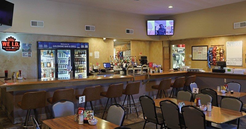 Interior, tables and chairs in dining area