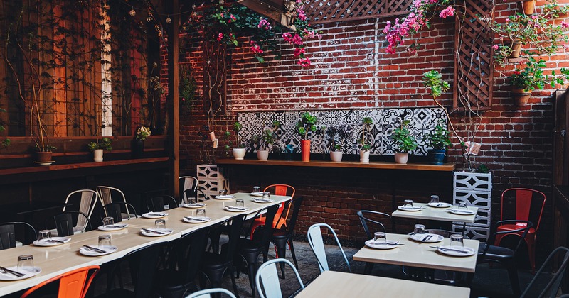 Covered patio with set dining tables