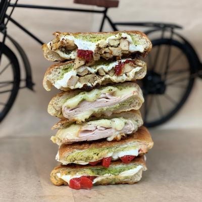 Stack of grilled paninis served on the table.