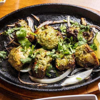 Chicken korma in a skillet, top view.