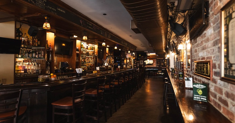 Bar area, bar stools neatly lined up