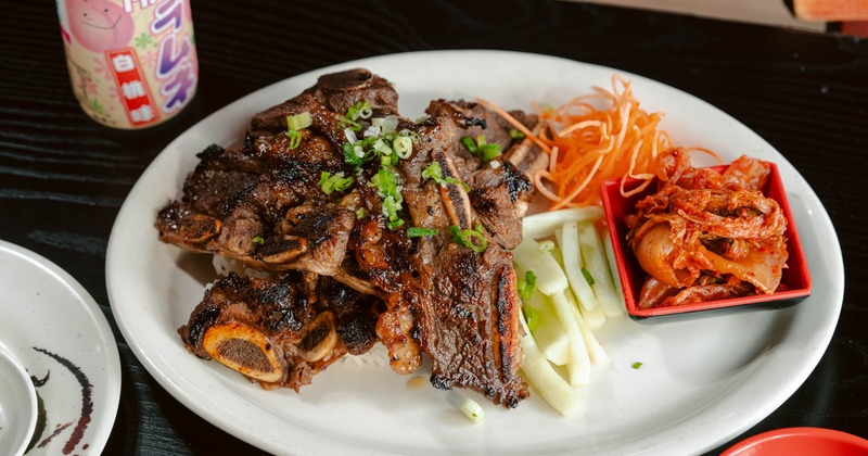 Grilled Korean LA Galbi short ribs served with side kimchi