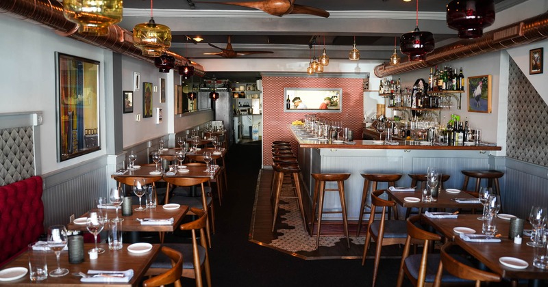 Interior, dining area on the left and bar on the right